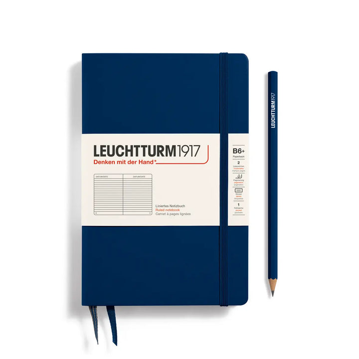 Blue notebook with a pencil on a white background, featuring the Leuchtturm1917 brand.