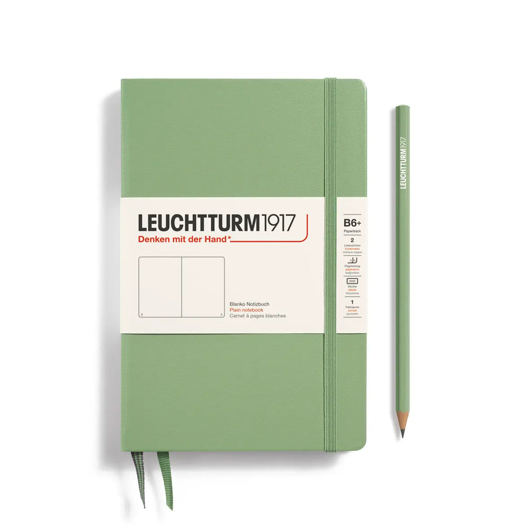 Green notebook with a pencil on a white background, featuring Leuchtturm1917 branding.