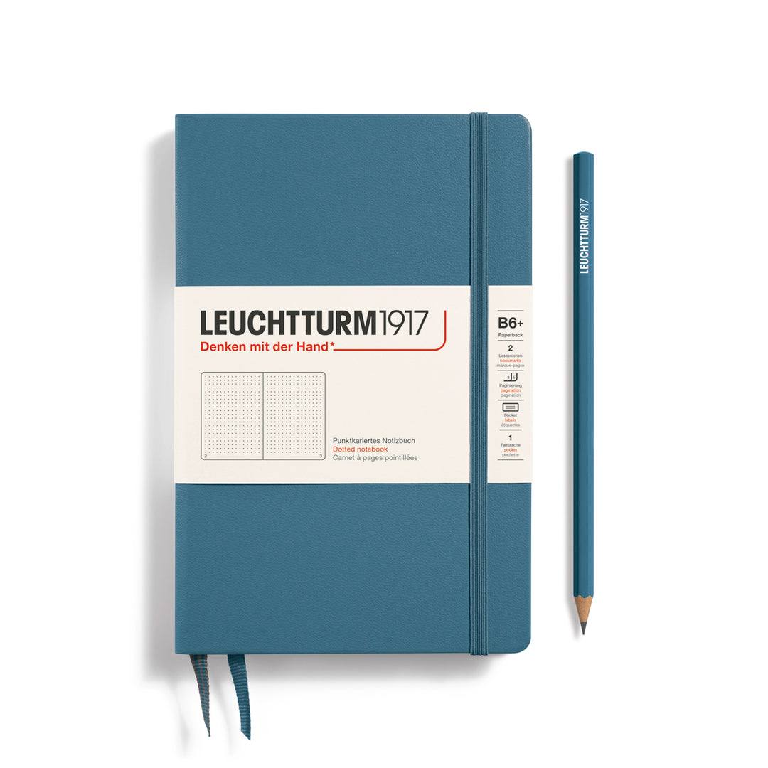 Blue notebook with white label and pencil on a white background, featuring Leuchtturm1917 branding.